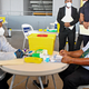 Papua New Guinea’s Prime Minister James Marape (R) preparing to receive a dose of the AstraZeneca Covid-19 vaccine in Port Moresby on March 30, 2021.
